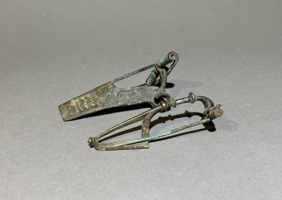 two metal scissors that are sitting on a table