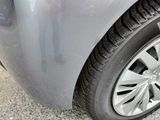 a close up of a car ' s tire on the ground