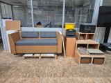a couch, chair, table, and television in a room