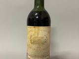 a close up of a bottle of wine on a table