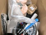 a cardboard box filled with assorted items in it