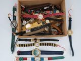 many different watches and bracelets in a box