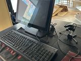 a computer on a desk with a mouse and keyboard
