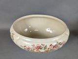 a white bowl with a floral design on it