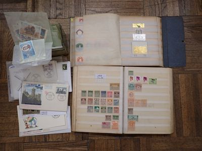 a lot of stamps on a book on the floor