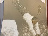 a picture of a man on a surfboard on a table