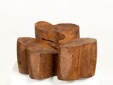 several pieces of wood stacked on top of each other on a white surface
