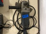 a drill and other tools on a table