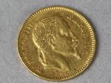 a close up of a gold coin with a woman ' s face on it