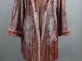 an image of a fur coat on a mannequin stand
