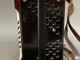 a small accordion that is sitting on a table