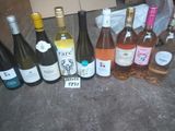 several bottles of wine are lined up on a table