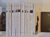 many books that are on a shelf in a book case