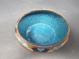 a blue bowl sitting on top of a table