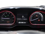 the dashboard of a car with a speedometer, gauges, and a steering wheel