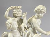 a statue of two cherenshes with flowers in their hands