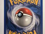 a close up of a pokemon card on a white surface