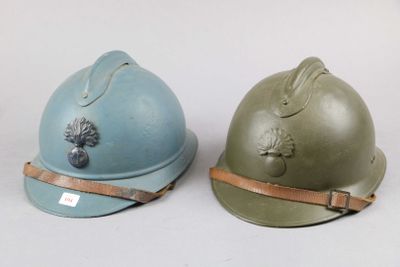 pair of british ww1 helmets with leather straps