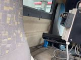 a seat in the back of a truck with a computer on it