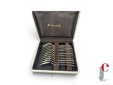 six forks in a box with a leather case