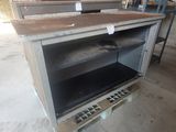 an oven that is sitting in the middle of a room