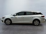 a picture of a white car parked in a garage