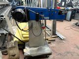 a picture of a machine that is working on a piece of metal