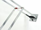 a close up of a metal object on a white surface