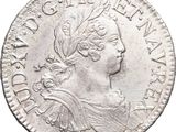 gros plan d'une pièce de monnaie sur fond blanc