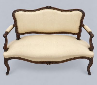 an image of a wooden and upholstered couch with beige upholstered upholstered