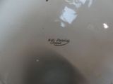 a close up of a white bowl with writing on it