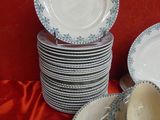 a lot of plates that are sitting on a table