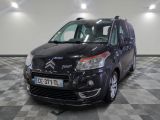 the small black van is parked on a checkered tile floor