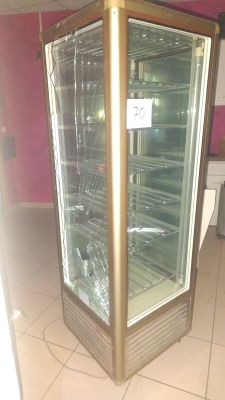a glass display case in the middle of a room