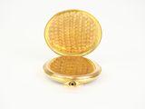 an image of a gold pocket watch on a white surface