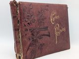 un vieux livre orné d'une croix et de fleurs