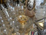 a lot of glassware on a table in a store