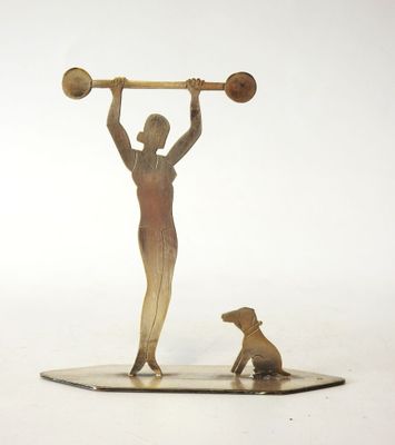 statue of a woman with a barbell and a dog on a white surface