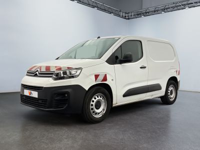 the white van is parked in a room with a gray floor