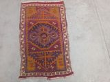 three rugs are laid out on the floor in a room