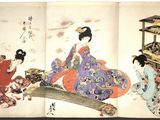 two asian women in kimono robes sitting on the floor