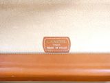 an image of a close up of a purse with a label on it