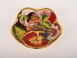 a small plate with a flower design on it