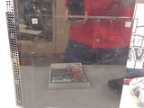 a reflection of a person taking a picture in a mirror