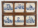 four blue and white tile pictures of a windmill, a boat, a windmill, and a windmill