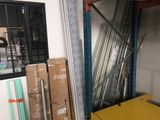 a yellow table in the middle of a room filled with boxes