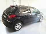 a picture of a black car parked in a garage