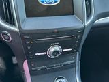 a close up of a person driving a car with a remote control