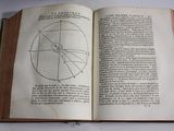 an open book with a drawing of a circle on it