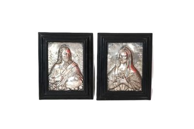 two framed pictures of jesus and mary on a white background